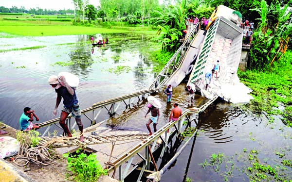 A bailey bridge on Sariakandi road at Sabashpur under Gabtoli Upazila in Bogura district collapses when a cement-laden over weighted truck climbs it to cross the area defying all road safety restrictions.