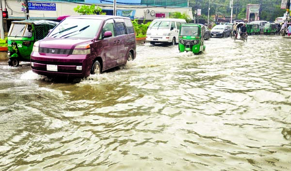 Only a little rain creates waterlogging in almost every road in Chattogram city making situation tough for commuters to move. The photo was taken from in front of Probartak Crossing on Sunday.