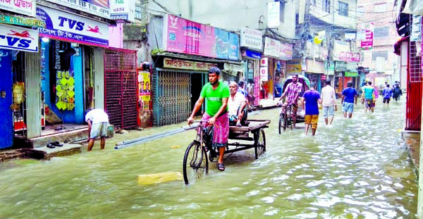 Incessant rain for last couple of days causes severe waterlogging in different parts of the city while poor drainage system and mismanagement of city authorities intensifies the sufferings of people. This photo was taken from Bangshal area on Wednesday.