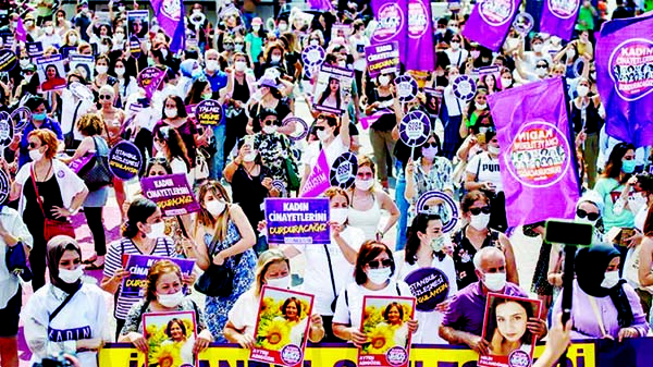 Demonstrators hold placards and portraits of women killed in recent years during a protest in Istanbul. Photo: Agency