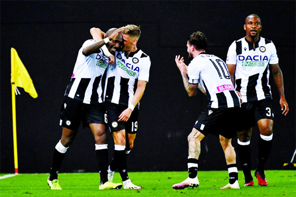 Udinese's Ivorian midfielder Seko Fofana (left) celebrates with teammates after scoring a goal during Italian Serie A football match between Udinese and Juventus at the Dacia Arena Stadium in Udine on Thursday.