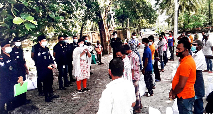 Captain of RAB-8 Additional DIG Atika Islam, BPM distributes Eid gifts among the surrendered pirates in Bagerhat on Friday.