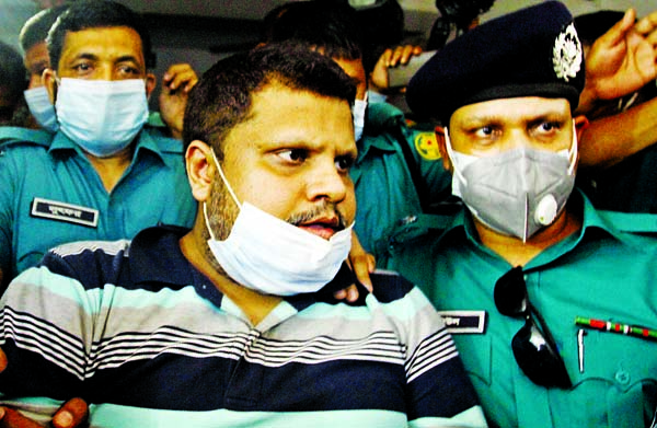 Police produce Regent Hospital Chairman Mohammad Shahed before a Dhaka court on Sunday.
