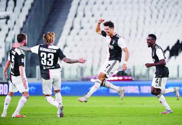 FC Juventus's Cristiano Ronaldo (2nd right) celebrates his goal during a Serie A football match between FC Juventus and Sampdoria in Turin, Italy on Sunday.