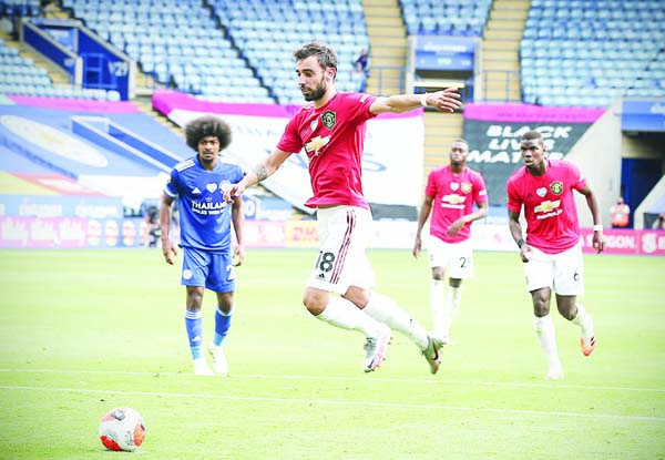 Man Utd's Bruno Fernandes scores their first goal from penalty spot against Leicester during their English Premier League match on Sunday.