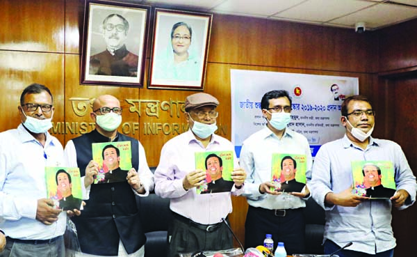 Information Minister Dr Hasan Mahmud, along with other distinguished guests holds the copies of a book titled 'Mujib Theke Sajib' published from Joyeeta Publications at its cover unwrapping ceremony marking the birthday of PM's ICT Adviser Sajib Wazed