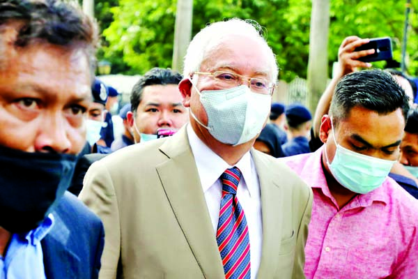 Former Malaysian Prime Minister Najib Razak arrives at Kuala Lumpur High Court in Kuala Lumpur on Tuesday.