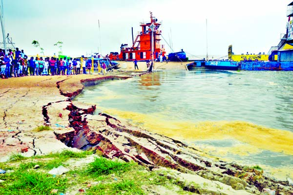 Shimulia Ferry Ghat No-3 in Munshiganj washes away on Tuesday due to strong current of Padma River on Tuesday.