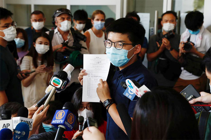 Pro-democracy activist Joshua Wong registers as a candidate for the upcoming Legislative Council election in Hong Kong, China.