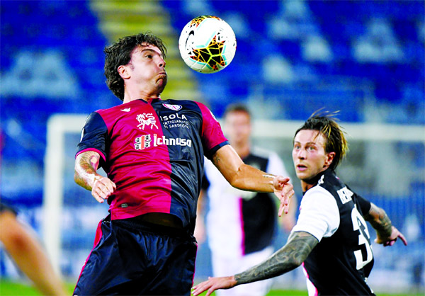 Cagliari's Alberto Paloschi (left) in action Against Juventus in Cagliari, Italy on Wednesday.