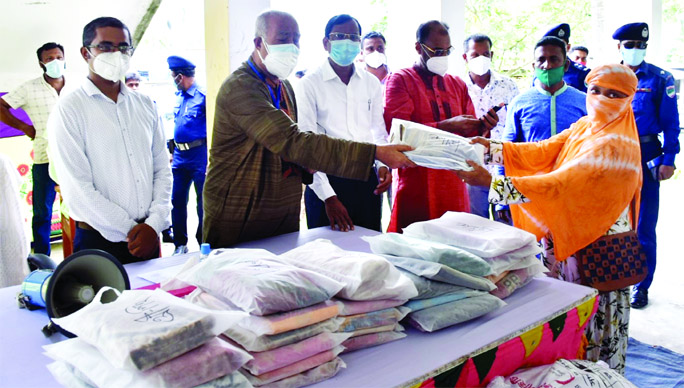 KCC Mayor Alhaj Talukder Khaleque distributes relief goods among poor people at different Unions of Rampal upazila on Wednesday.