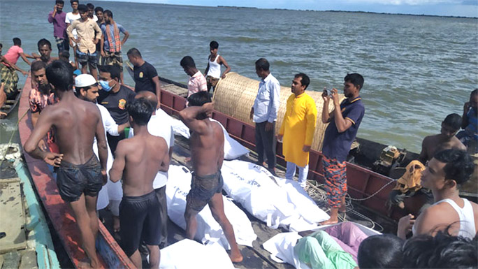 Fire service personnel recover bodies of 17 persons who died in a boat capsize on Wednesday at Haor Gobindasree Rajalikanda, Ujirpur in Madan Upazila under Netrokona district.