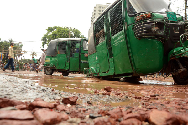 The main road of the city's Kamalapur area in a dilapidated condition disrupting traffic movement. The snap was taken on Friday.