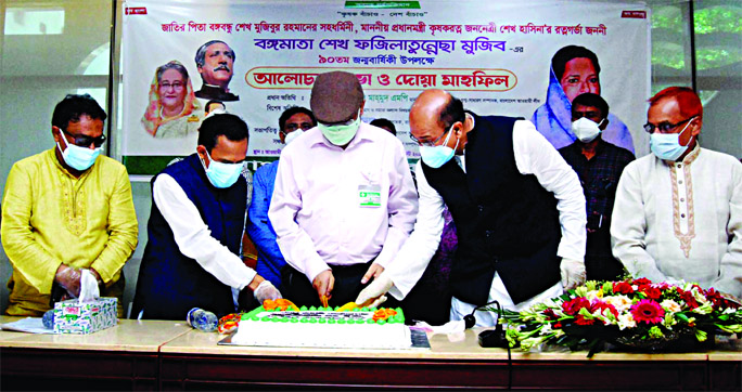 Information Minister Dr Hasan Mahmud along with others cutting cake marking 90th birth anniversary of Bangamata Sheikh Fazilatunnesa Mujib organised by Bangladesh Krishak League at AL office in the city's Bangabandhu Avenue on Saturday.