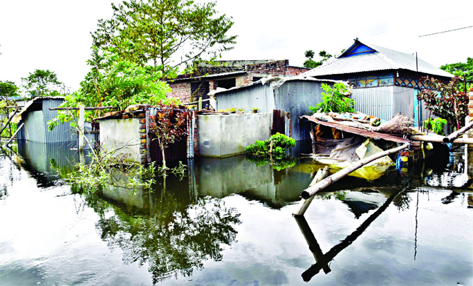 Several houses and establishments at Kadamtoli in Keranigonj submerged by floodwater due to swelling in water level of the rivers around Dhaka. This photo was taken on Saturday.