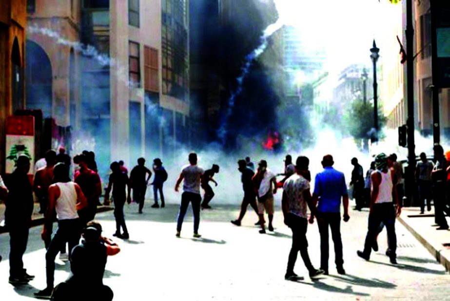 Demonstrators gather as tear gas is fired by security forces during a protest near the parliament following Tuesday's blast, in Beirut, Lebanon on Saturday. ReutersThaier Al-Sudani