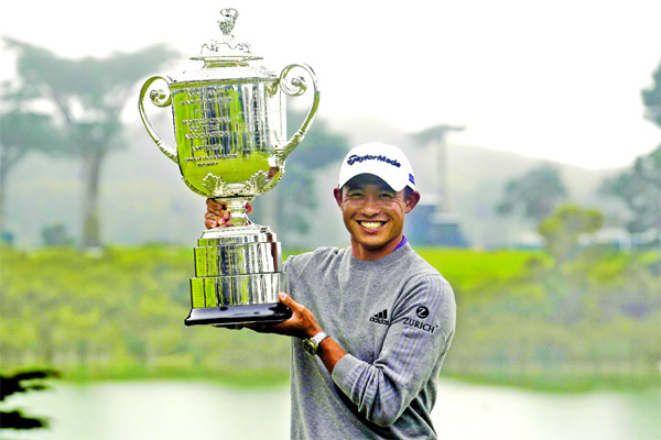 Collin Morikawa holds the Wanamaker Trophy after winning the PGA Championship golf tournament at TPC Harding Park in San Francisco on Sunday.