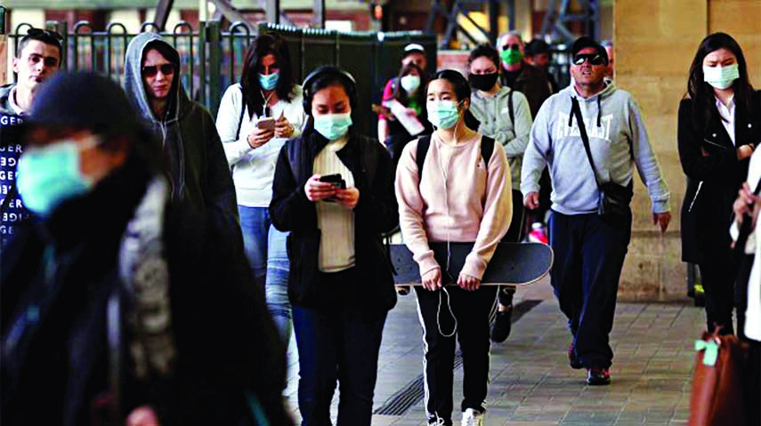 Commuters walk at Central Station, as the state of New South Wales experiences a decrease in new cases of the coronavirus disease (COVID-19), in Sydney, Australia on Tuesday.