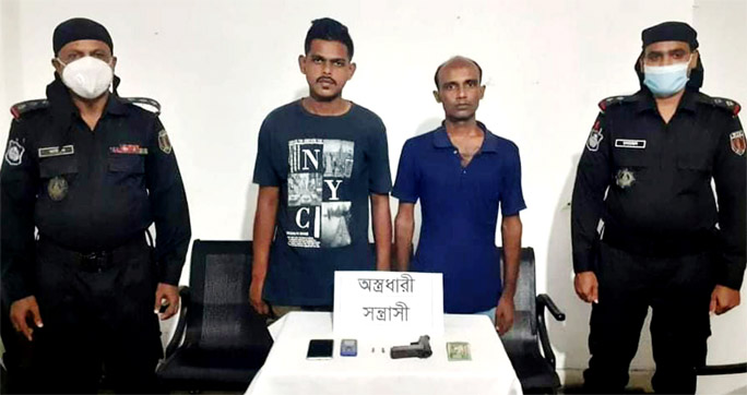 RAB-10 detains two criminals with foreign made pistol conducting raid at South Keraniganj on Wednesday.