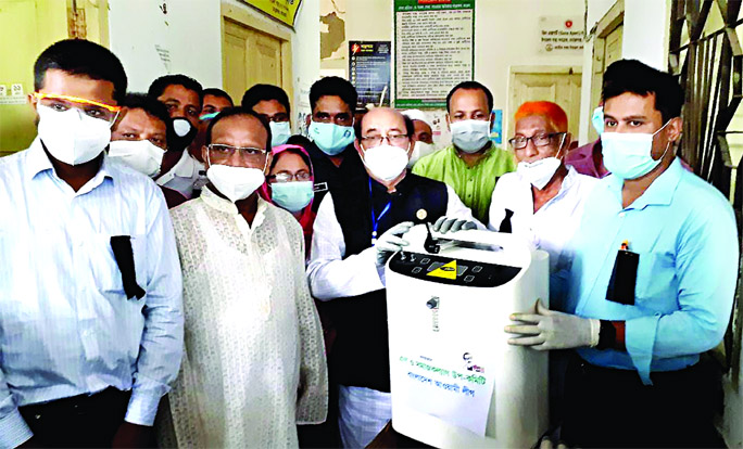 Advocate Amirul Alam Milon, MP hands over PPE to Dr. Kamal Hossain Mufti, Upazila Health and Family Planning Officer in Moralganj of Bagerhat District on Wednesday.