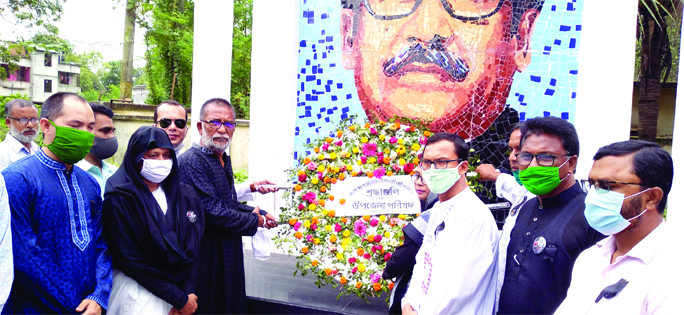 Naogaon Sadar MP Barrister Nizam Uddin Jalil Jan, Deputy Commissioner Md Harun-ur-Rashid, Superintendent of Police Abdul Mannan Mia place wreaths at the portrait of Father of the Nation Bangabandhu Sheikh Mujibur Rahman at the central Shaheed Minar at Muk