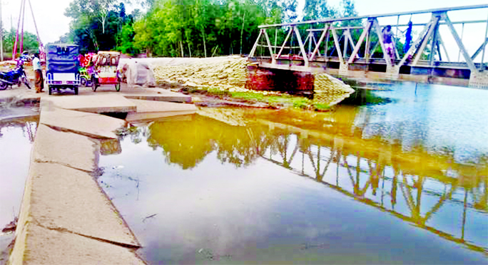 People of Sherpur's Shimultoli area are now facing severe trouble due to suspension of vehicle movement following damage of Sherpur-Jamalpur Highway along with an important bridge by heavy current of floodwater.