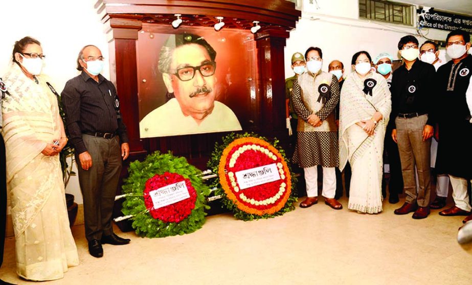 Md. Nur Ali, Secretary of Health and Family Planning Division under the Ministry of Health and Family Planning places floral wreaths at portrait of Bangabandhu founded at the Health and Family Planning Office marking the National Mourning Day 2020 on Satu