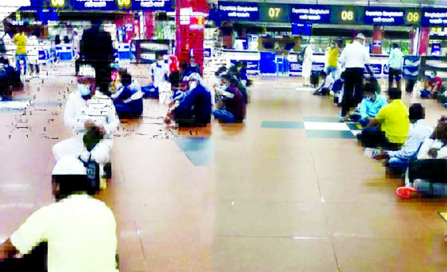 68 Bangladeshi workers who were sent back from Abu Dhabi stage sit-in protest at the Hazrat Shahjalal International Airport on Monday.