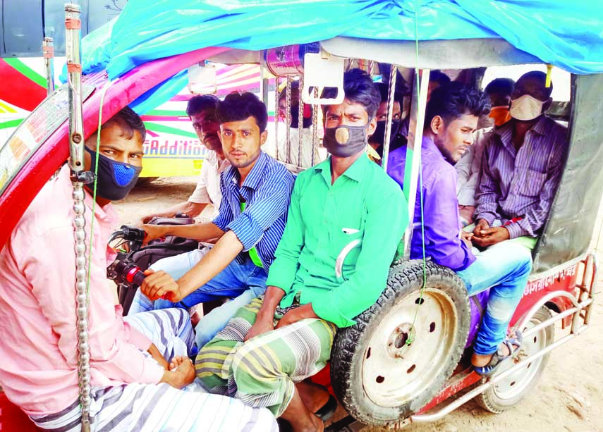 An Easybike is a seen carrying extra passengers with total disregard to physical distancing norms in Panchbibi.