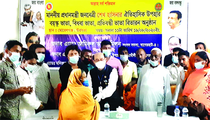 Advocate Amirul Alam Milon, MP, distributes allowances among the elderly, widows and financially insolvent disable persons at a programme in the conference room of Morelganj Municipality in Bagerhat on Wednesday morning.