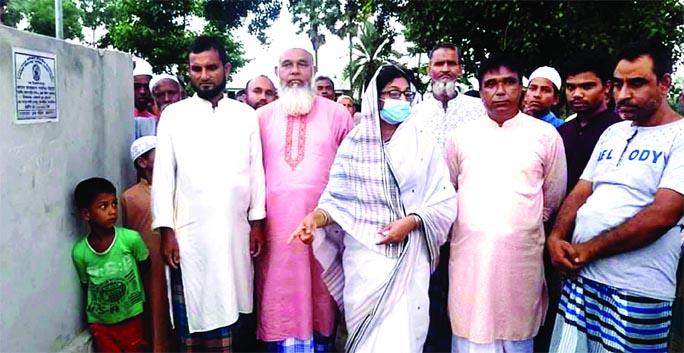 Panel Chairman of Mymensingh Zila Parishad inaugurates the development works of Kushmail graveyard in Phulbaria upazila on Friday.