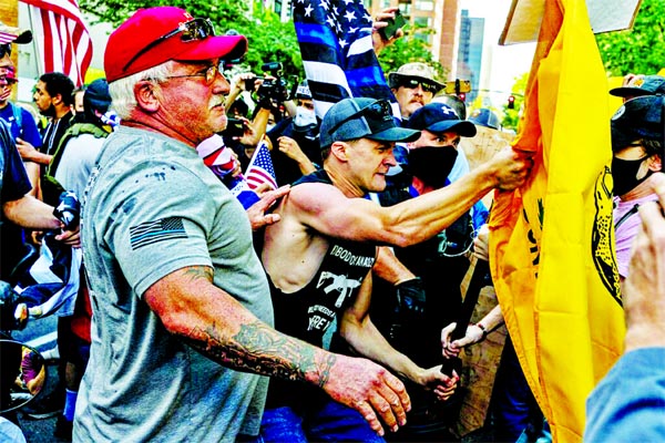 Far-right demonstrators, many carrying American flags, clashed with far-left demonstrators in Portland, Oregon, US on Saturday.