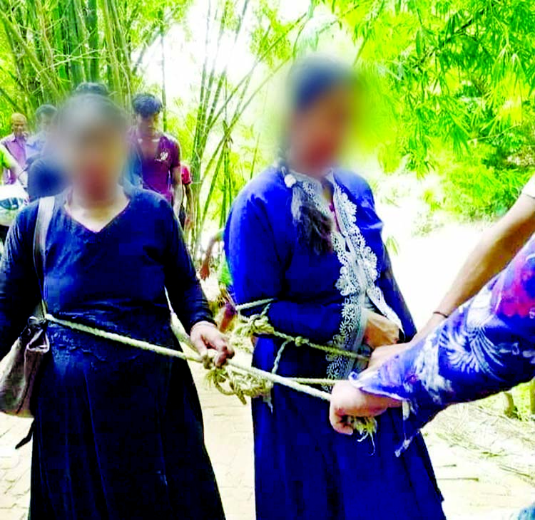 A mother and her daughter being dragged to an office tied with a rope at Chakaria in Cox's Bazar on Sunday. Photo Collected