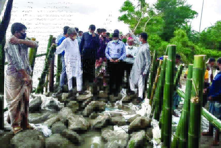 Barguna DC visits damaged cross dam affected by strong current of Baleshwar River at the Sadar Union under Patharghata upazila of Barguna on Monday.
