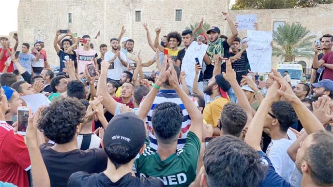 Libyans chant slogans during a demonstration protesting poor public services at the Martyrs' Square at the centre of the GNA-held Libyan capital Tripoli.