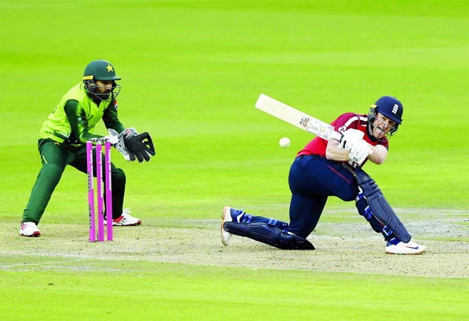 England's captain Eoin Morgan (right) bats during the first Twenty20 International cricket match between England and Pakistan at Old Trafford in Manchester on Friday. The match was abandoned due to rain.