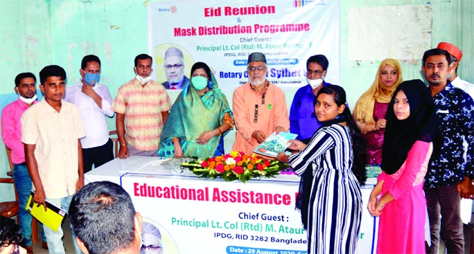 IPDG Lt. Colonel (retired) Principal M. Ataur Rahman Peer distributes educational assistance to the learners sponsored by Rotary Club of Sylhet City on Saturday.
