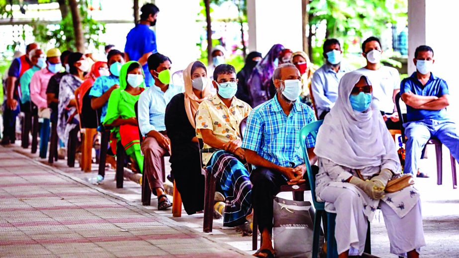 Suspected patients are seen waiting at the city's Mugda General Hospital to get tested for coronavirus on Saturday amid rising virus infection in the country due to people's total disregard to health safety rules and not maintaining social distancing no