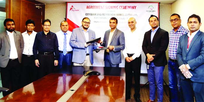 Md. Abdul Wadud, DMD and Head of Commercial & Trade Business of City Bank Limited and Saif Uddowlah, Managing Director of Petrochem (Bangladesh) Limited, exchanging document after signing an agreement for Employee Banking facility at the bank's head offi