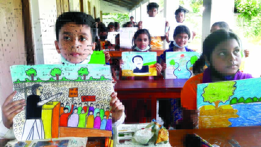 Sopner Khoje, a voluntary organization of Narail organized children's Art Competition at the city's Gohathkhola area on Monday. Children hold up their paintings in a photo session following the competition.