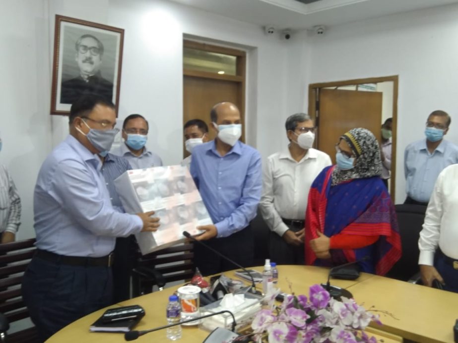 Dr. Sultan Ahmed, Secretary of Power Division, handing over Ã’N-95 3M 8210 for doctor and nurses for "The Sarkari Karmachari Hospital" to Sheikh Yousuf Harun, Secretary of the Ministry of Public Administration on behalf of Dhaka Electric Supply Compa
