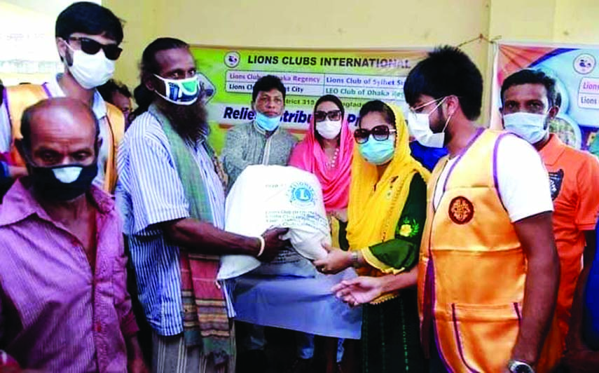 Relief Distribution program organized by Lions Club of Dhaka Regency, Lions Club of Sylhet City, Lions Club of Sylhet Surma and Leo Club of Dhaka Regency District 315 B1 Bangladesh at Jagannathpur under Sunamgonj in Sylhet recently.