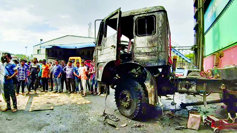 The burnt-out wreckage of an oil tanker of a lorry that exploded inside a private container depot in Chattogram's Patenga on Wednesday morning killing at least three people and four injured.