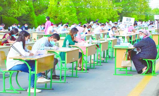Students take open-air entrance exams amid the ongoing pandemic in Tashkent, Uzbekistan on Wednesday.