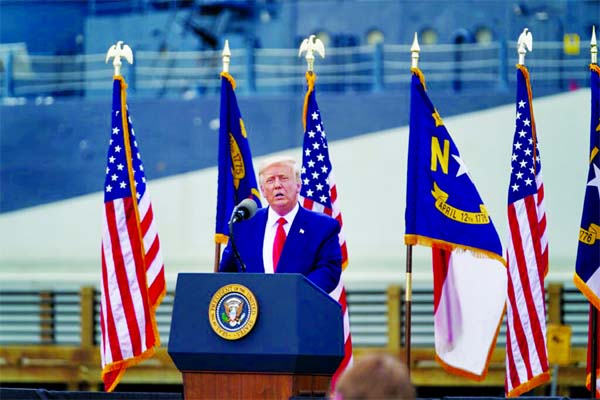 President Trump at the Battleship North Carolina in Wilmington on Wednesday. He told reporters later that people should test the system by voting twice, an illegal act.