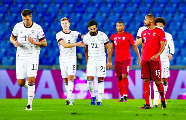 Germany's Ilkay Gundogan (21) celebrates scoring their first goal with teammates against Switzerland at the St Jakob-Park in Basel on Sunday.