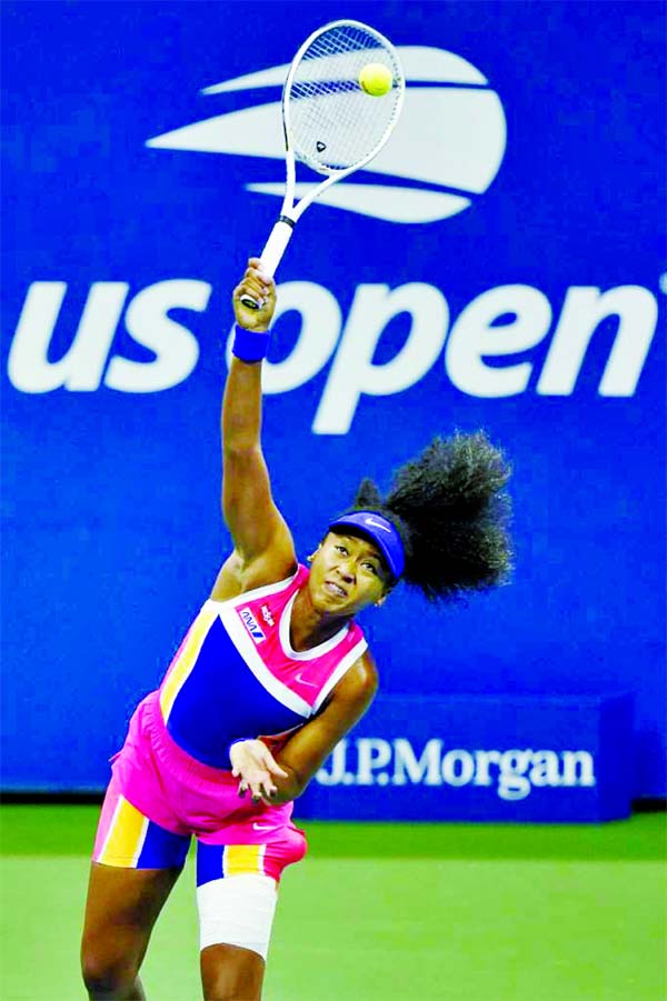 Naomi Osaka of Japan serves the ball against Anett Kontaveit of Estonia on day seven of the 2020 U.S. Open tennis tournament at USTA Billie Jean King National Tennis Center.