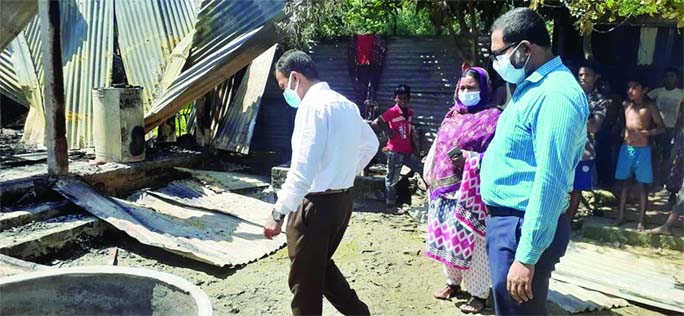K. M. Yasir Arafat, UNO of Bijoynagar in Brahmanbaria visits the burnt home of Ali Hossain, a physically challenged person of Khatabari village of Budhanti Union of the Upazila, and provide food assistance to him.