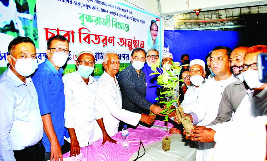 Abu Jahed Mohammad Nasir Uddin, General Secretary of Chattogram City Awami League (AL), distributes saplings among the local people on Monday as part of the party's tree plantation programme.
