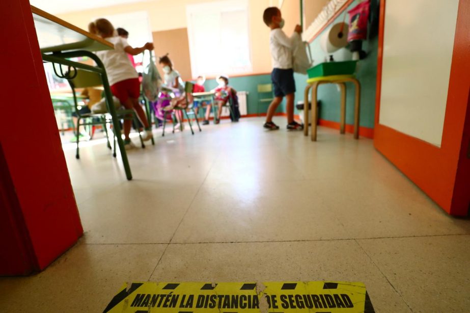 A social distancing mark is seen on the floor as pupils arrive on the first day of school after summer holidays amid the coronavirus outbreak, at Mariano Jose de Larra public school in Madrid, Spain on Tuesday.